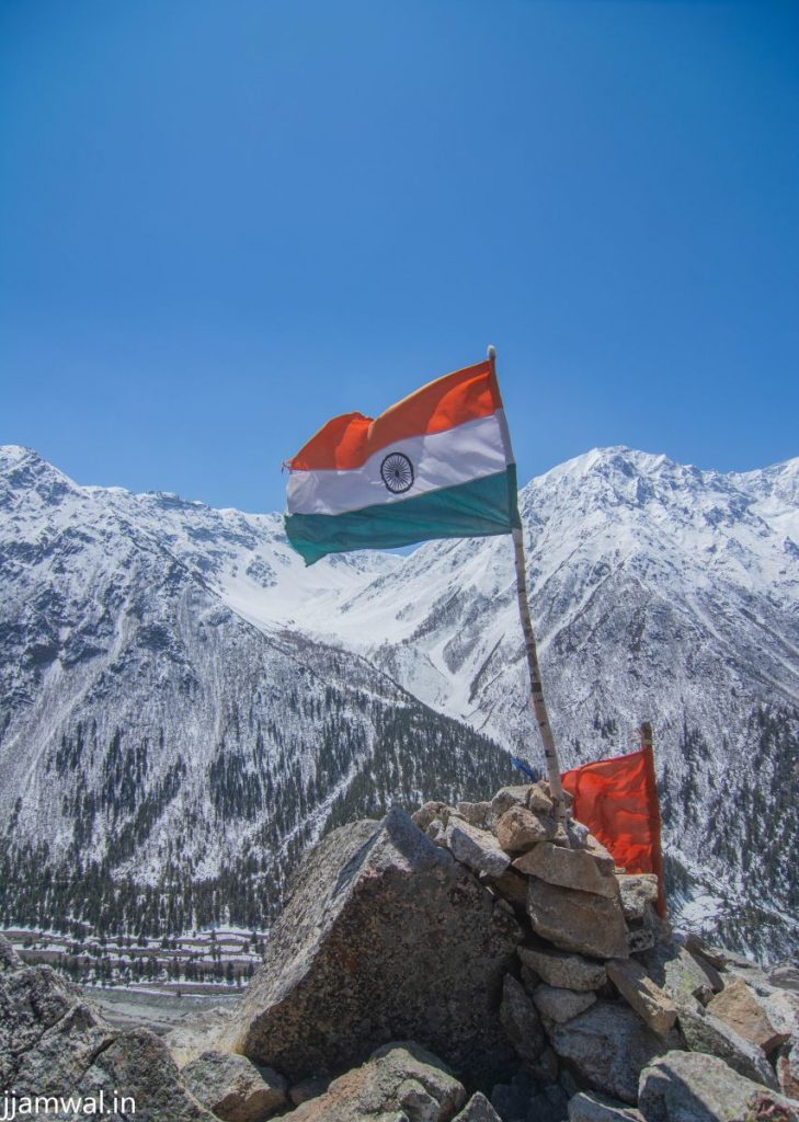 Indian flag on mountain ridge in Chitkul